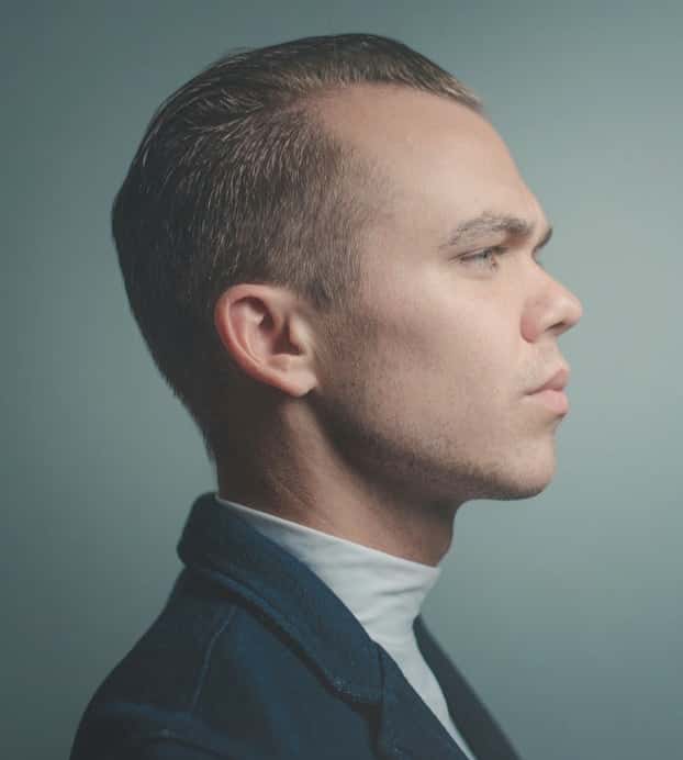 A profile photo of Alex Spencer looking serious